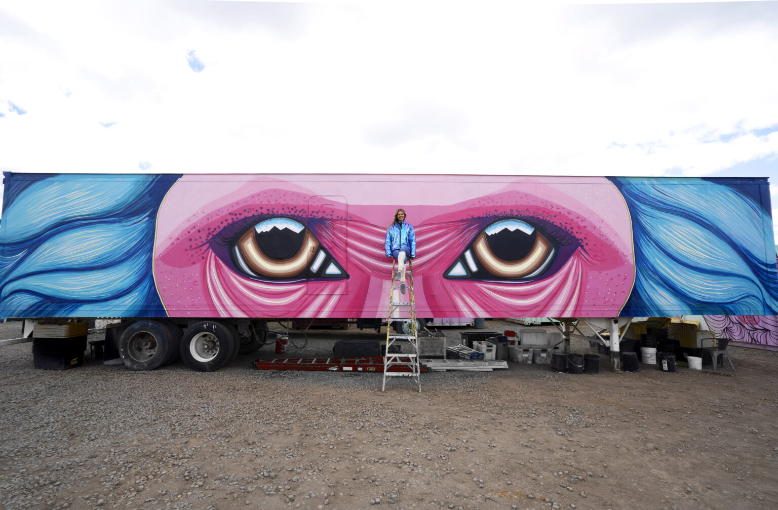 Mural of a monkey’s eyes painted on a trailer, Animalize World Mural Tour