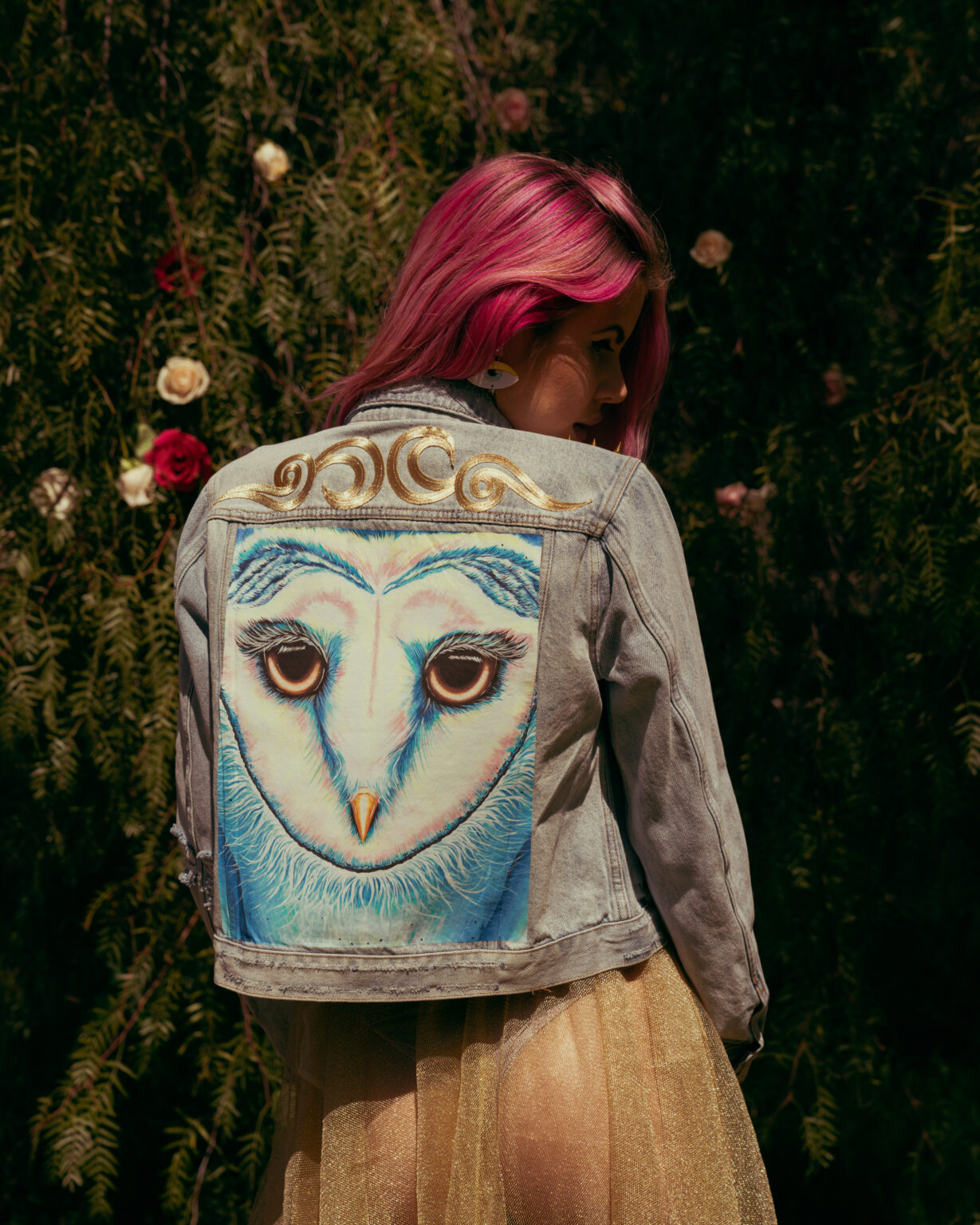 Back of an Animalize capsule denim jacket with an owl painting