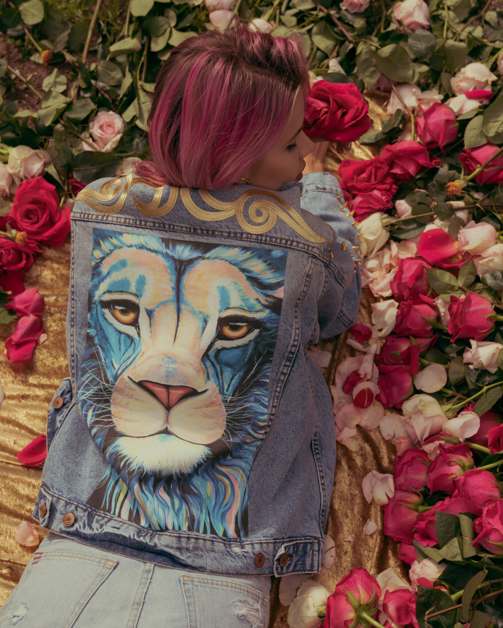 Back of an Animalize capsule denim jacket with a lion painting